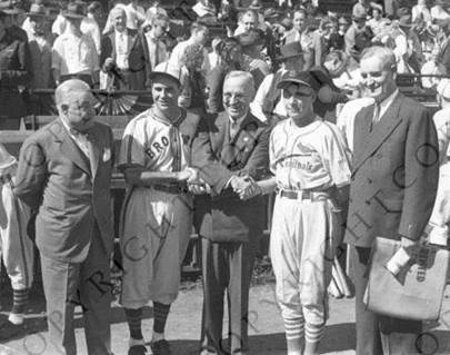 Senator Harry S. Truman shakes hands with the managers of the St. Louis Cardinals and the St. Louis Browns at the 1944 World Series in St. Louis, Missouri.