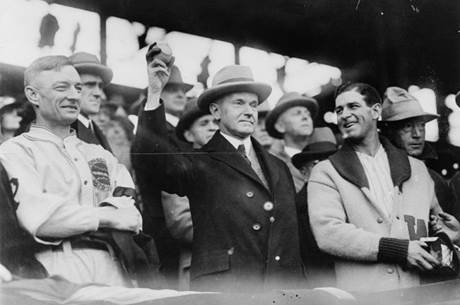 President Coolidge prepares to throw out the first ball of game three of the 1925 World Series, 1925