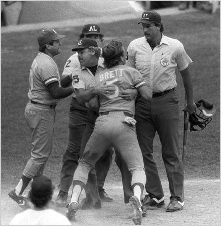George Brett was restrained after the umpire Tim McClelland, right, ruled the bat Brett used to hit a go-ahead homer on July 24, 1983, at Yankee Stadium was illegal.