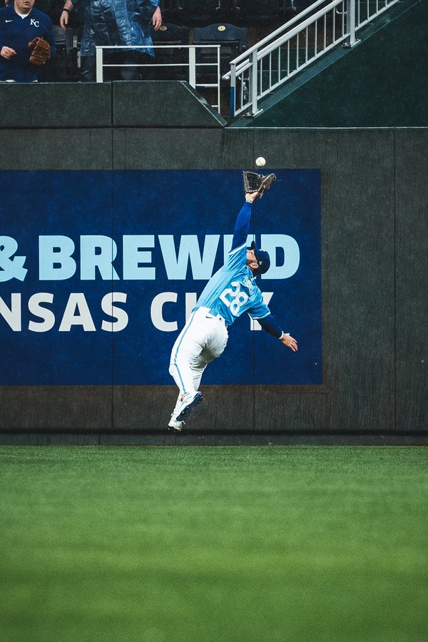 Kyle Isbel leaps and reaches to make a spectacular catch against the Blue Jays. (Photo by Jason Hanna/Kansas City Royals)