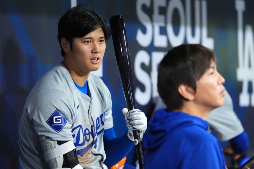 SEOUL, SOUTH KOREA - MARCH 20: Shohei Ohtani #17 of the Los Angeles Dodgers talks to his interpreter Ippei Mizuhara in the dugout during the 2024 Seoul Series game between Los Angeles Dodgers and San Diego Padres at Gocheok Sky Dome on March 20, 2024 in Seoul, South Korea. (Photo by Masterpress/Getty Images)