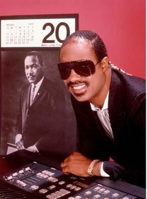 It's been 40 years since Stevie Wonder released "Happy Birthday" in honor of MLK, which ignited the campaign to commemorate him (helmed by Coretta Scott King, above, with Wonder) with a national holiday.