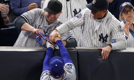 Two Yankees fans banned from World Series Game 5 after grabbing ball from  Betts | New York Yankees | The Guardian