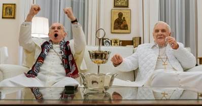 Popes Francis (Jonathan Pryce, left) and Benedict (Anthony Hopkins) bond over World Cup soccer in "The Two Popes."